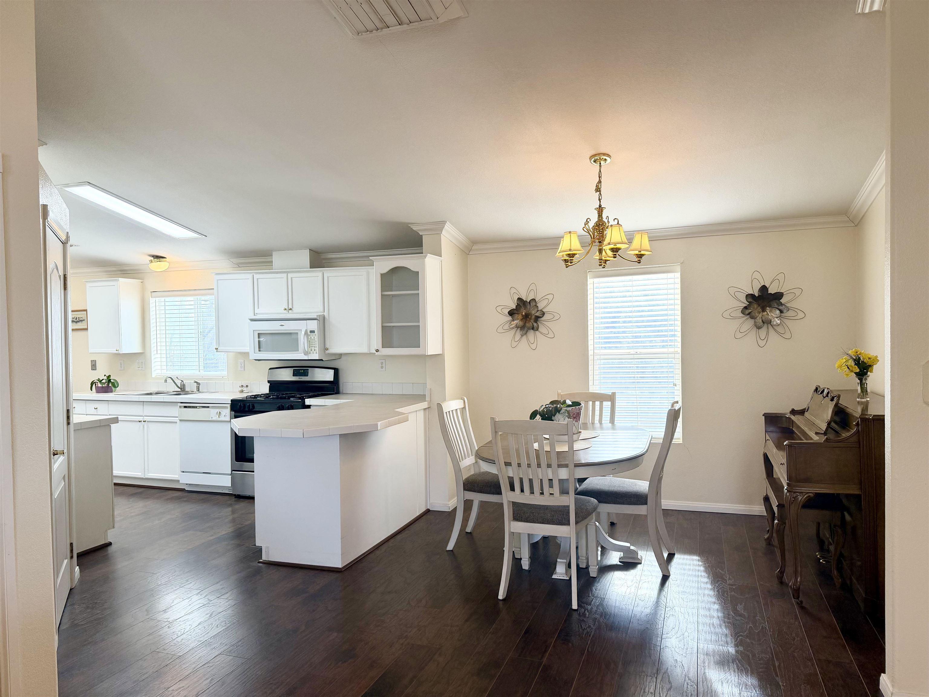 435 32 Road, Unit 480 Clifton, CO 81520 - Photo 8 of 23 a kitchen with a table and chairs in it