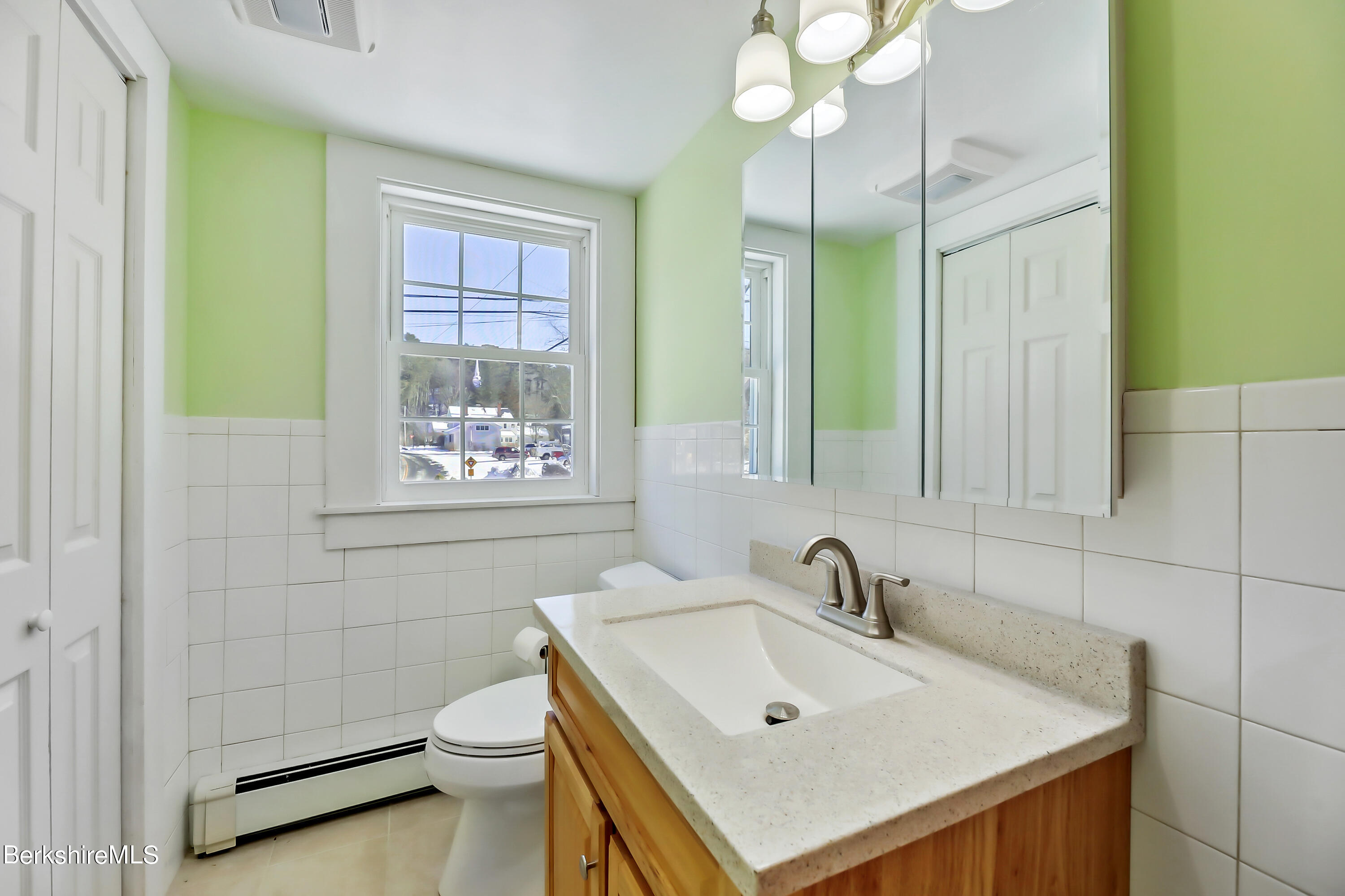 77 Clayton Mill River Road New Marlborough, MA 01244 - Photo 11 of 16 a bathroom with a sink a toilet and a mirror
