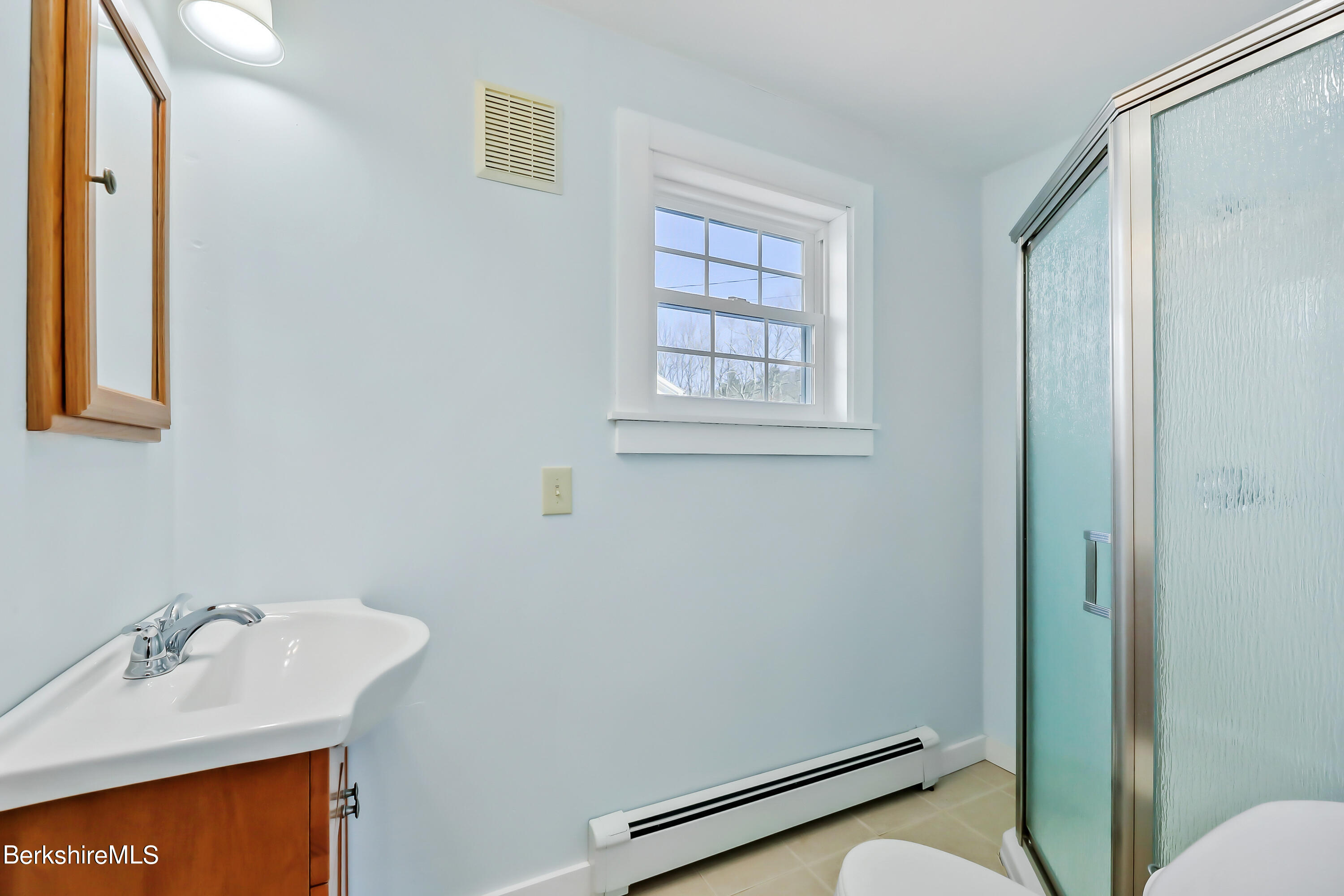 77 Clayton Mill River Road New Marlborough, MA 01244 - Photo 12 of 16 a bathroom with a sink a toilet and shower