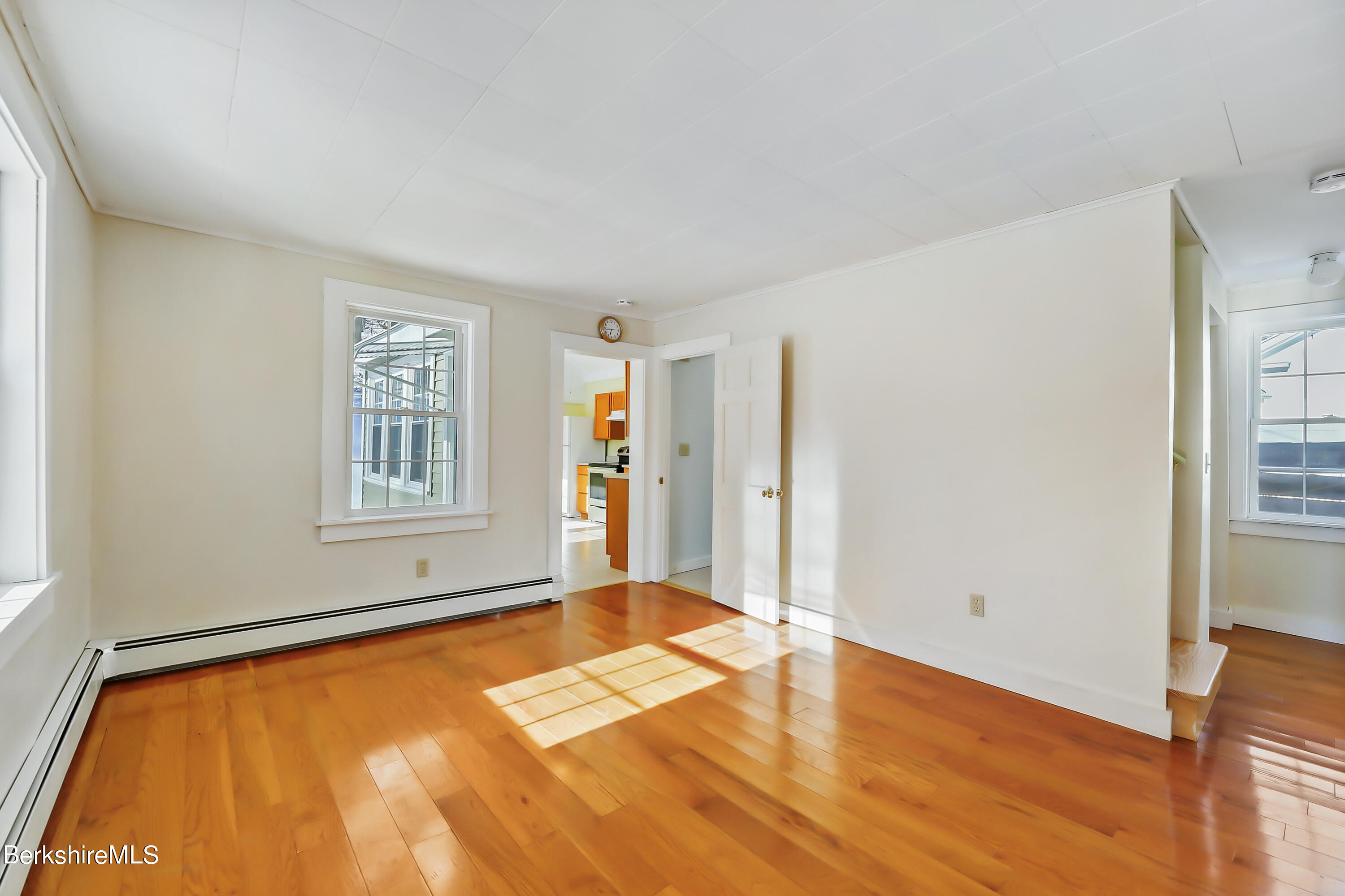 77 Clayton Mill River Road New Marlborough, MA 01244 - Photo 4 of 16 a view of a room with wooden floor and windows