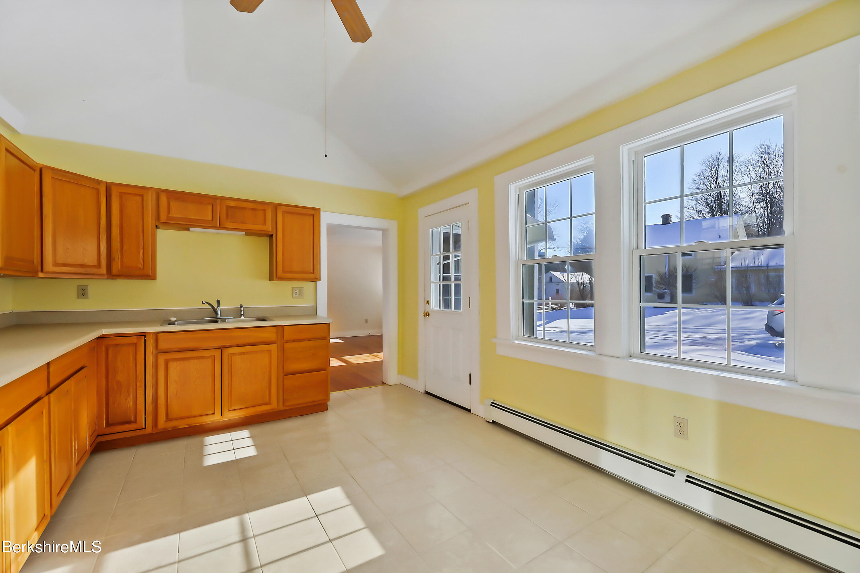77 Clayton Mill River Road New Marlborough, MA 01244 - Photo 7 of 16 a large kitchen with stainless steel appliances wooden cabinets a stove and a refrigerator
