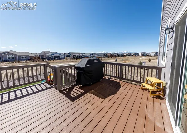 a view of a balcony with wooden floor