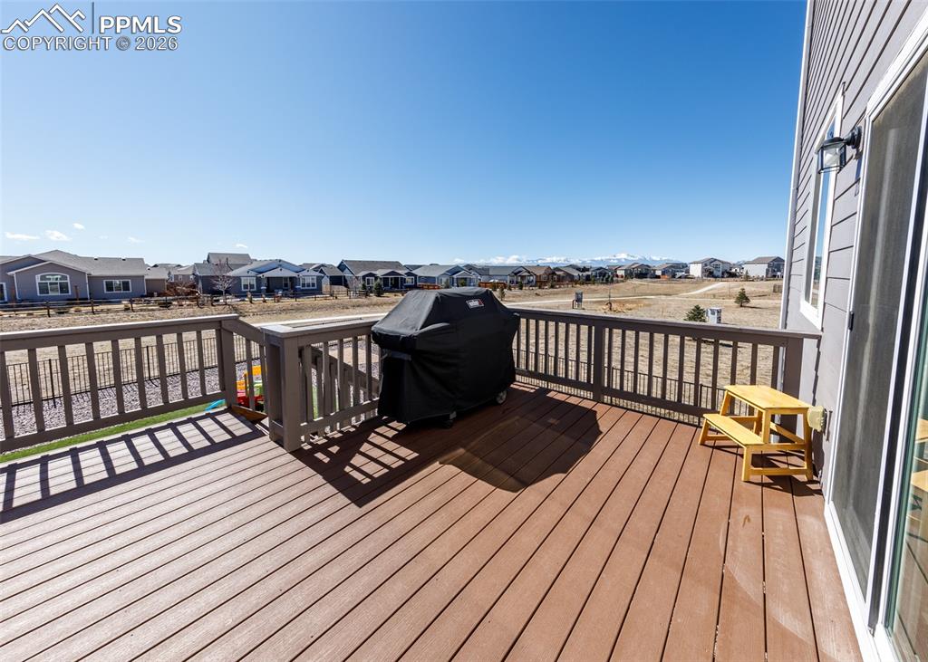 12653 Granite Ridge Drive Peyton, CO 80831 - Photo 22 of 50 a view of a balcony with wooden floor