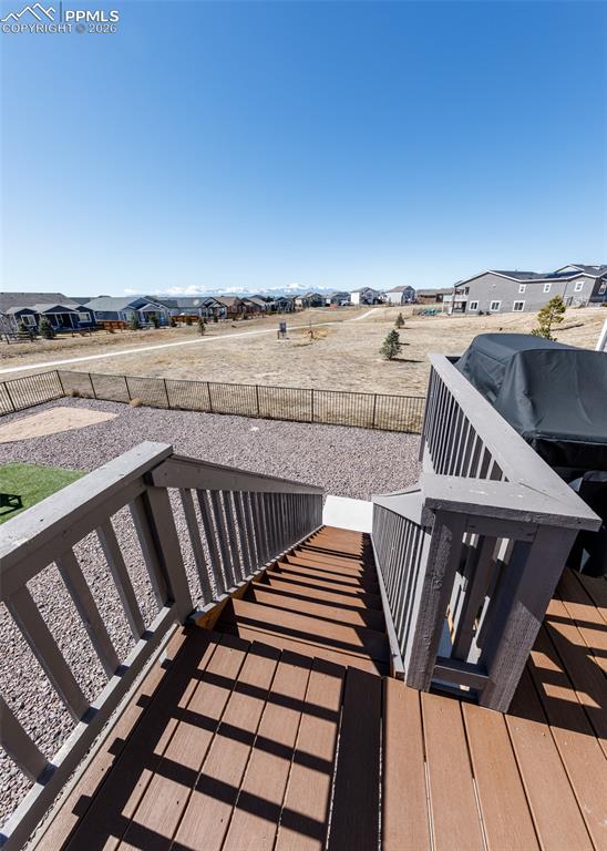 12653 Granite Ridge Drive Peyton, CO 80831 - Photo 23 of 50 a view of a balcony with wooden floor