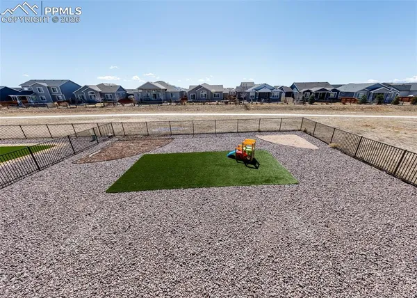 a view of a hallway with wooden floor and closet