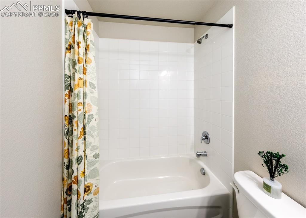 12653 Granite Ridge Drive Peyton, CO 80831 - Photo 29 of 50 a bathroom with a bathtub and shower