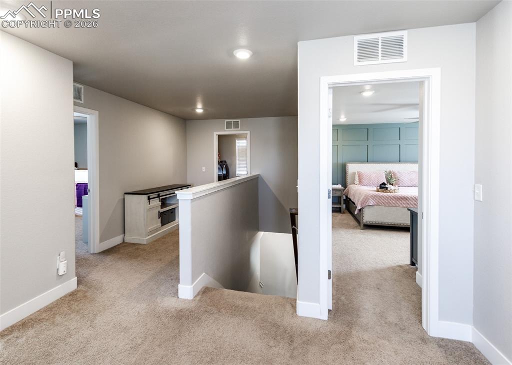 12653 Granite Ridge Drive Peyton, CO 80831 - Photo 31 of 50 a view of a hallway with a livingroom and furniture