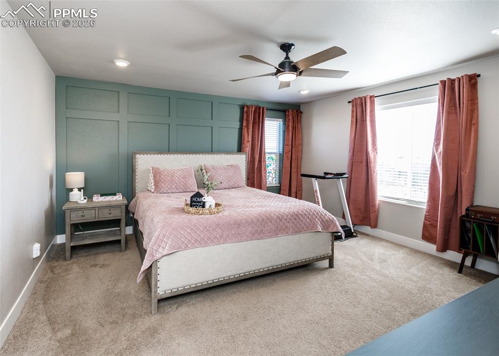 12653 Granite Ridge Drive Peyton, CO 80831 - Photo 32 of 50 a bedroom with a bed and a window