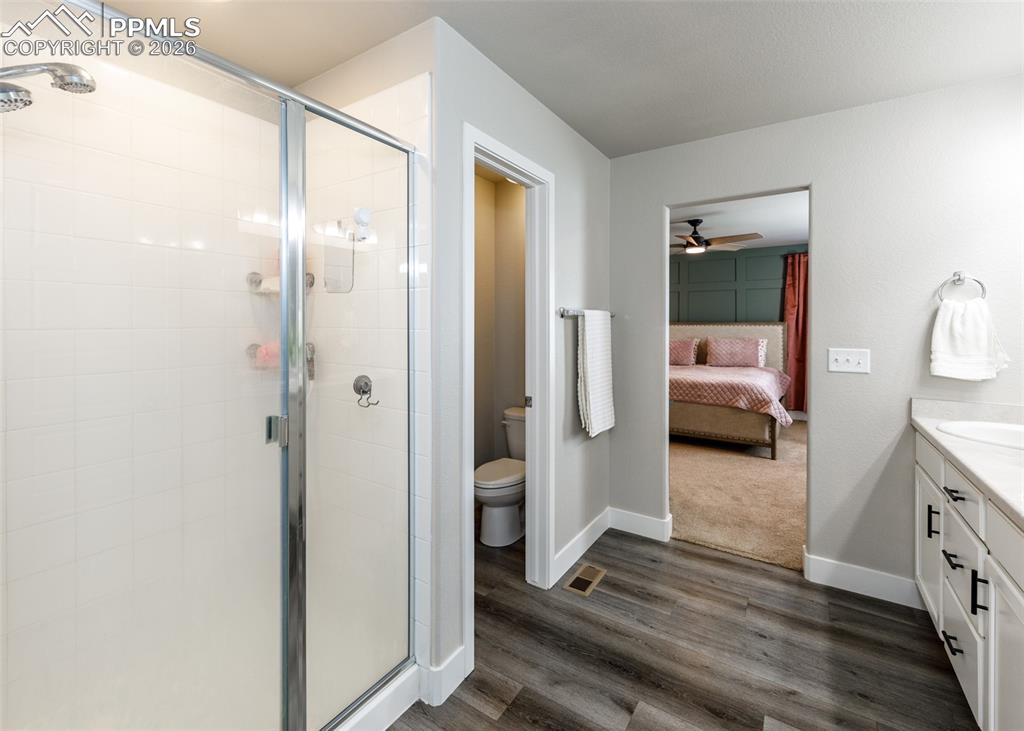 12653 Granite Ridge Drive Peyton, CO 80831 - Photo 35 of 50 a view of a bedroom from a bathroom