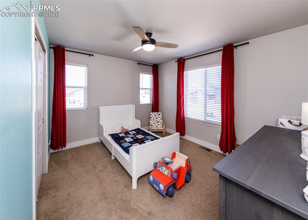 12653 Granite Ridge Drive Peyton, CO 80831 - Photo 37 of 50 a living room with furniture and a window