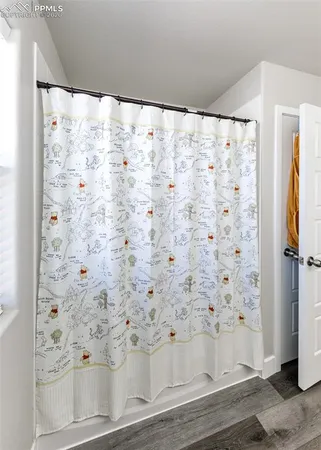 a bed room with a bed and a window