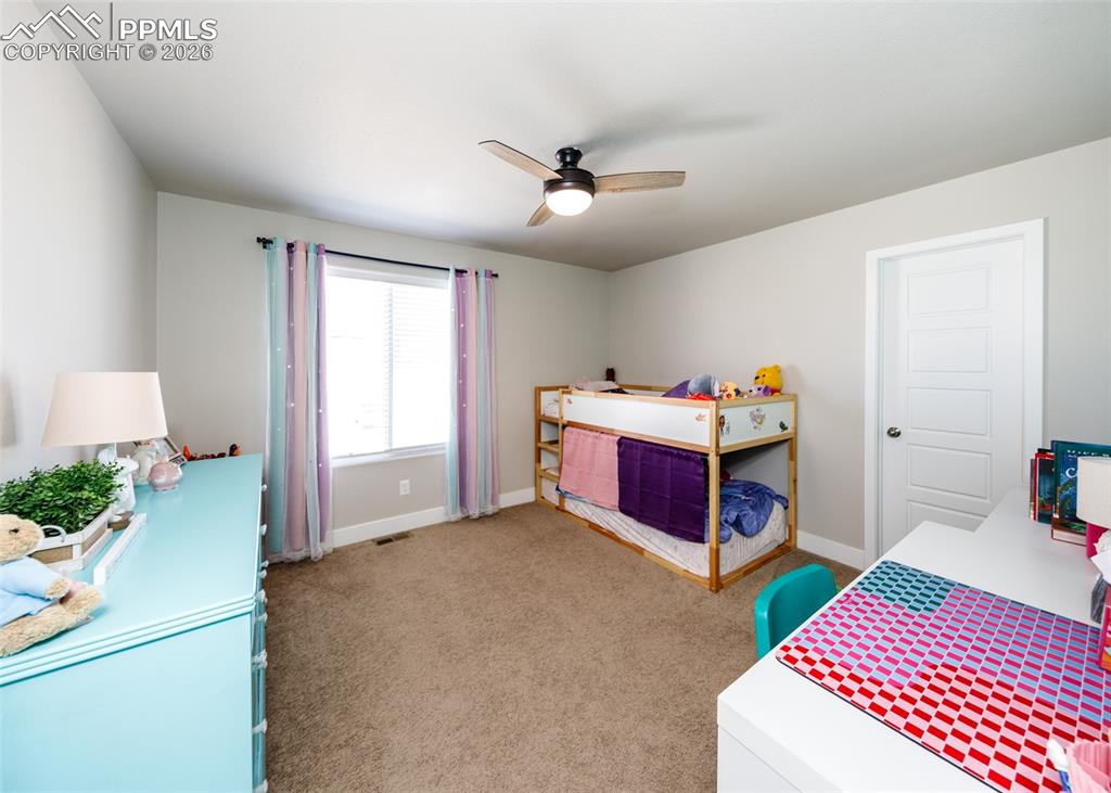 12653 Granite Ridge Drive Peyton, CO 80831 - Photo 40 of 50 a bed room with a bed and a window