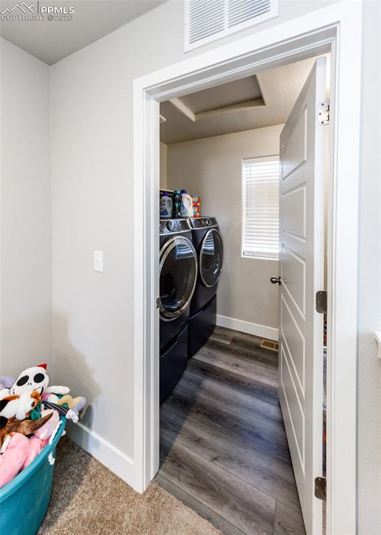 12653 Granite Ridge Drive Peyton, CO 80831 - Photo 42 of 50 a view of a hallway to a livingroom with furniture