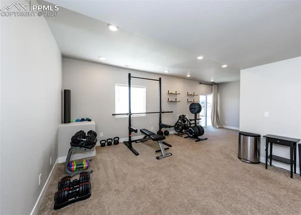 a view of an empty room and a window