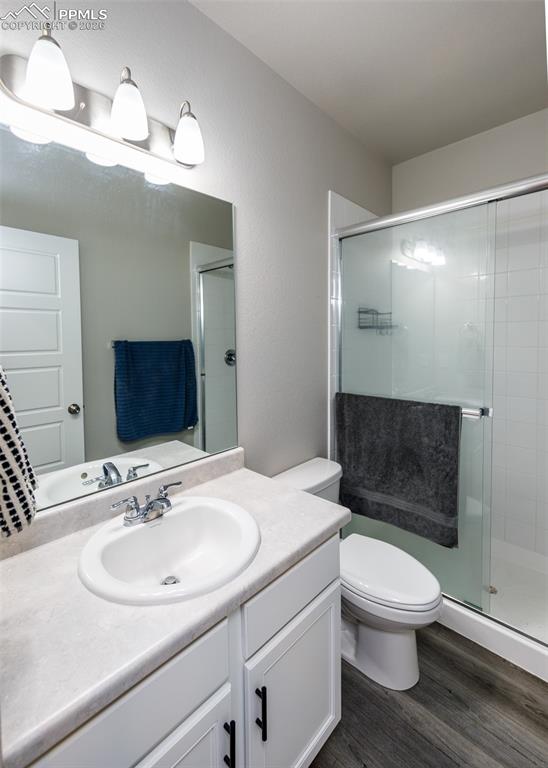12653 Granite Ridge Drive Peyton, CO 80831 - Photo 46 of 50 a bathroom with a sink a toilet and shower