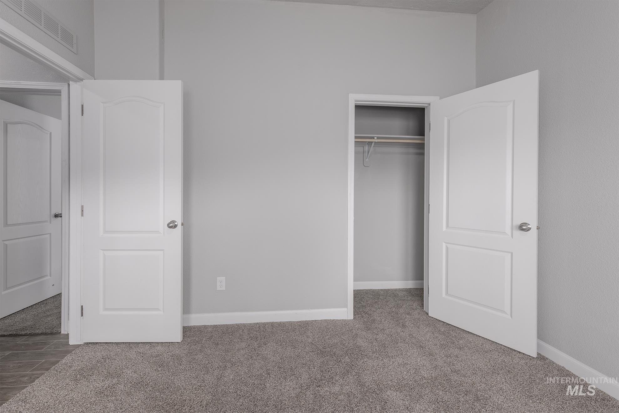 1587 Gentry Lane Weiser, ID 83672 - Photo 25 of 41 Unfurnished bedroom featuring carpet floors and a closet