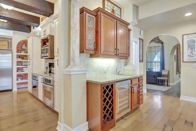 a kitchen with stainless steel appliances granite countertop a stove a sink and dishwasher