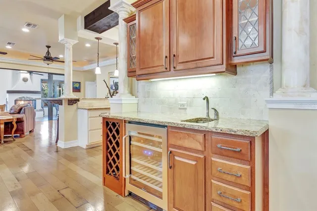 a kitchen with stainless steel appliances granite countertop a sink and cabinets