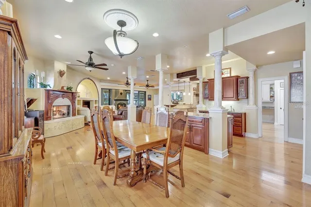a view of a dining room with furniture and a chandelier