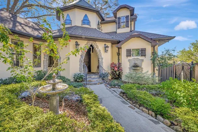 a front view of a house with garden