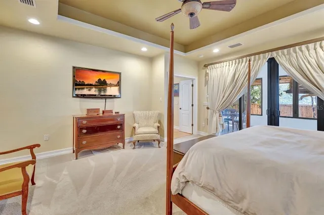 a en suite bathroom with a granite countertop sink and a mirror