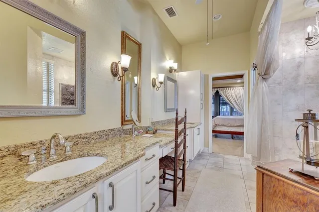 a view of walk in closet with clothes