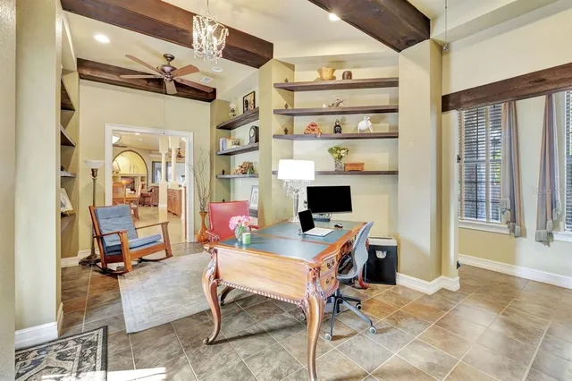 a workspace with kitchen island a table and chairs in it