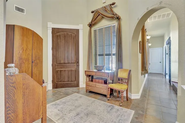 a view of a livingroom with furniture and staircase