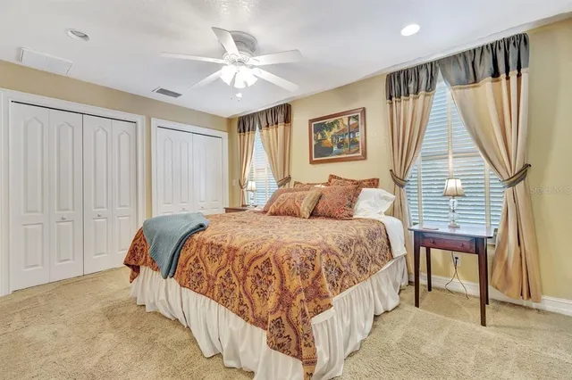 a living room with furniture and a glass door
