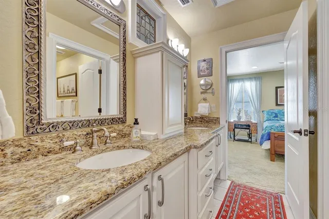 a view of a livingroom with workspace and a window