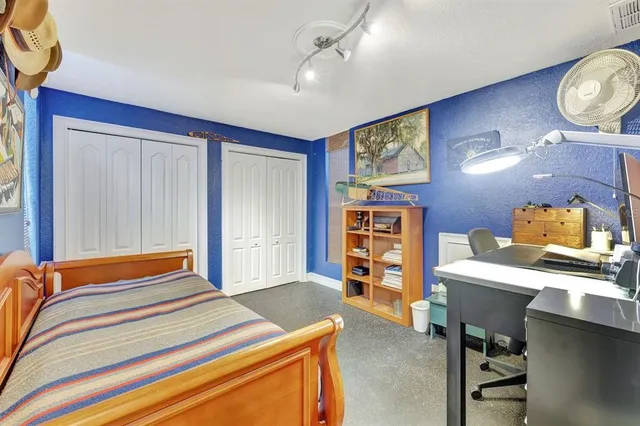 a view of a kitchen with large windows