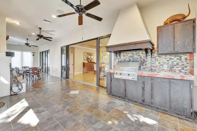 a view of a dining room with furniture water view and a chandelier