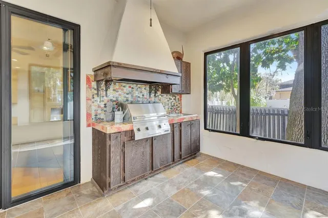 a bath tub sitting in a bathroom next to a window