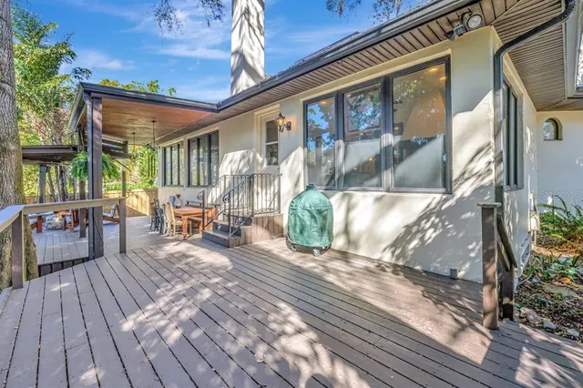 an aerial view of residential houses with yard