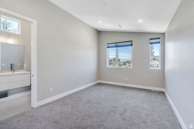 7045 South 300 East Midvale, UT 84047 - Photo 21 of 49 Carpeted bedroom featuring multiple windows, recessed lighting, and a white trim package