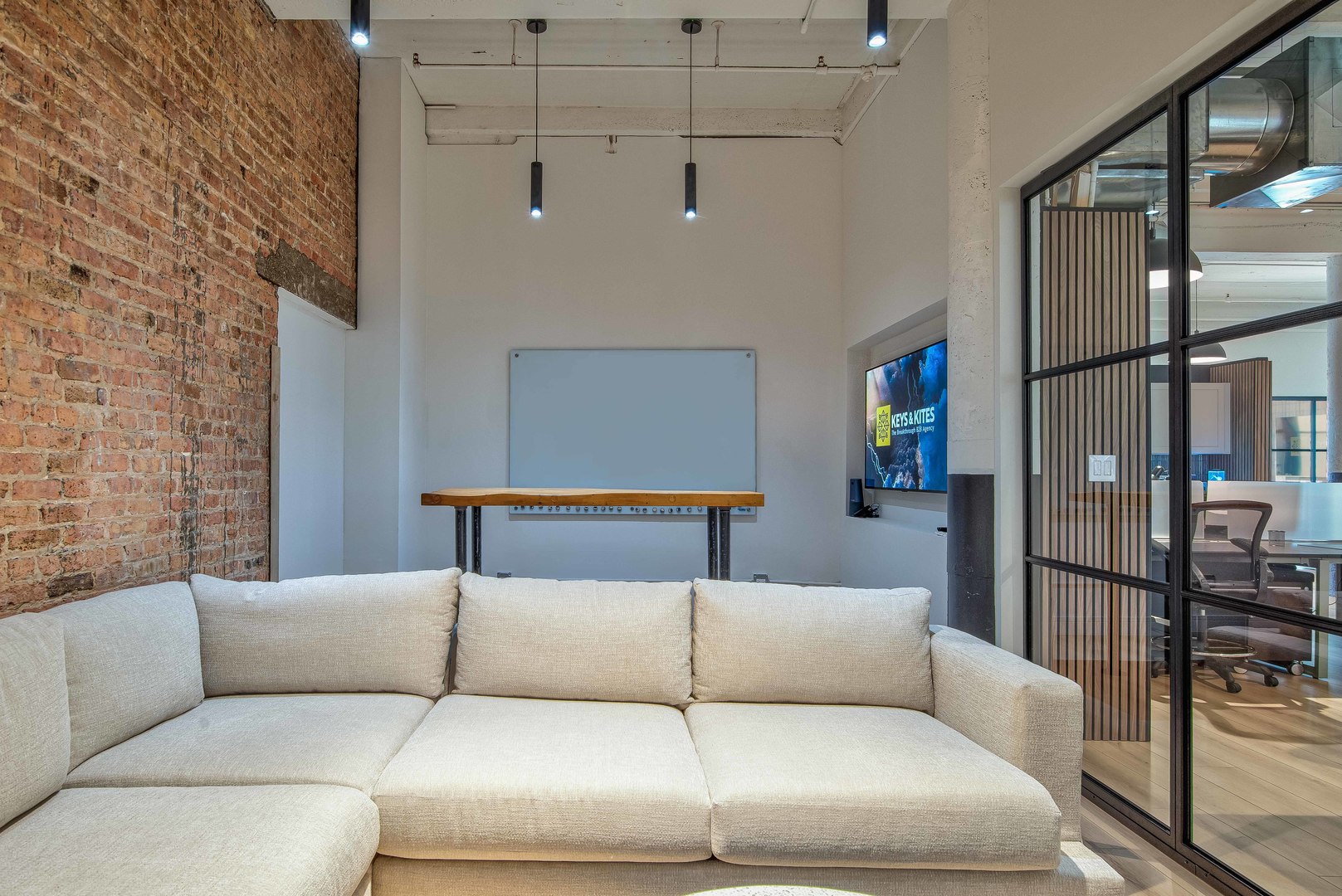 727 South Dearborn Street, Unit 211 Chicago, IL 60605 - Photo 26 of 34 a living room with a couch and a glass door