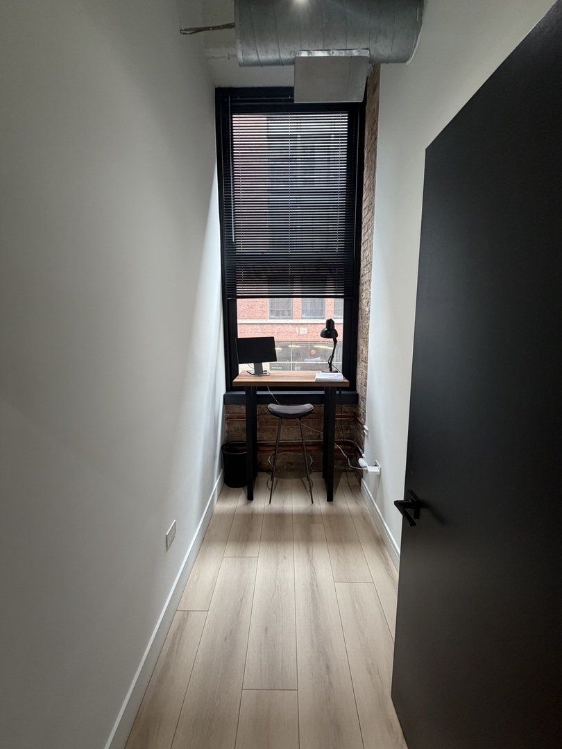 727 South Dearborn Street, Unit 211 Chicago, IL 60605 - Photo 32 of 34 a view of room with wooden floor and window