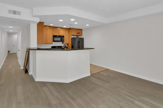 a view of kitchen with wooden floor