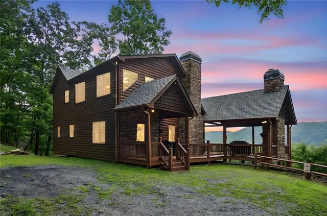 a view of a house with backyard porch and sitting area