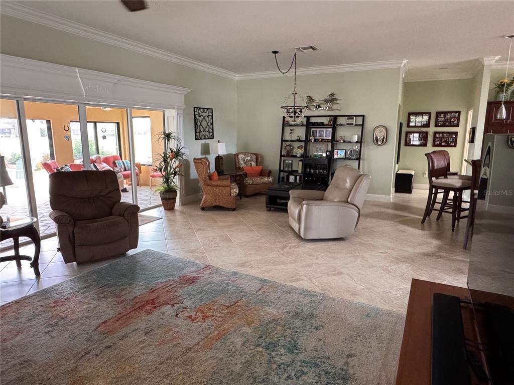 2005 Markridge Loop The Villages, FL 32162 - Photo 12 of 36 a living room with furniture and a window