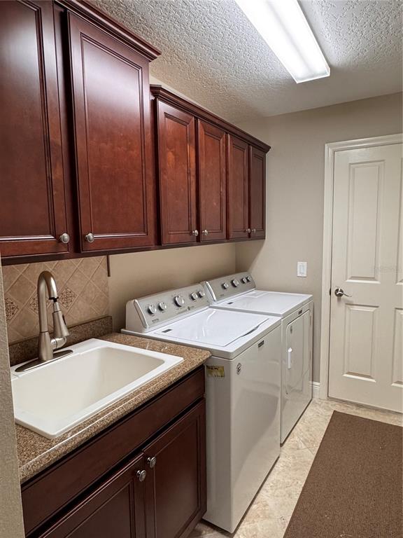 2005 Markridge Loop The Villages, FL 32162 - Photo 14 of 36 a utility room with dryer and washer
