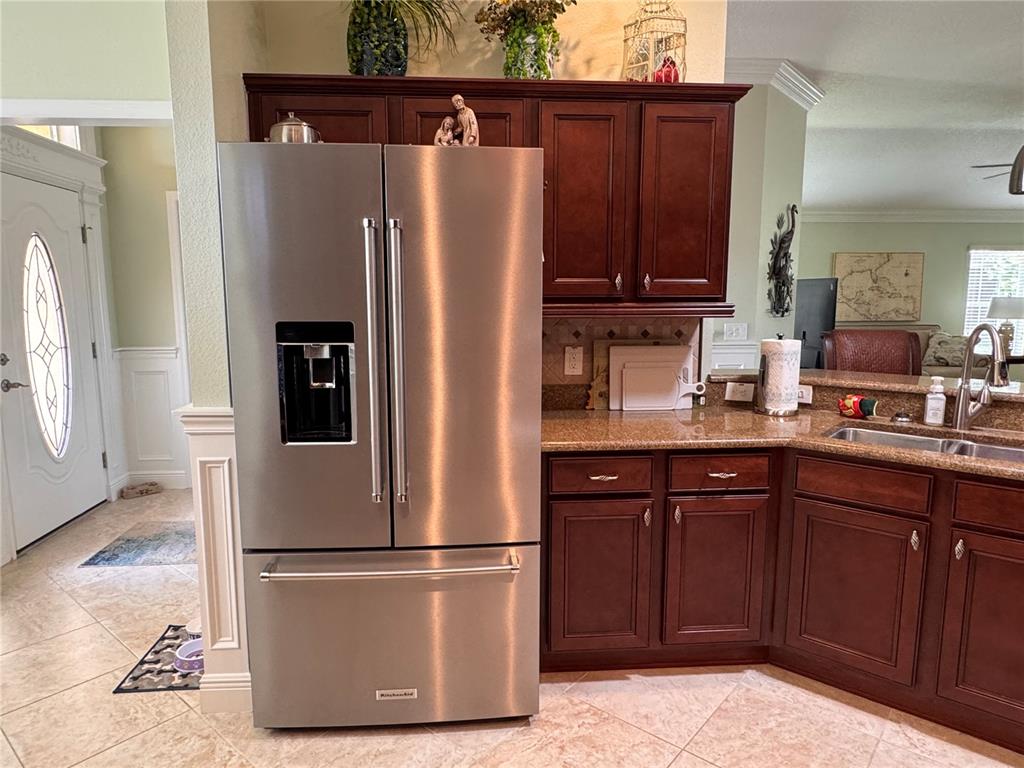 2005 Markridge Loop The Villages, FL 32162 - Photo 8 of 36 a white refrigerator freezer sitting in a kitchen