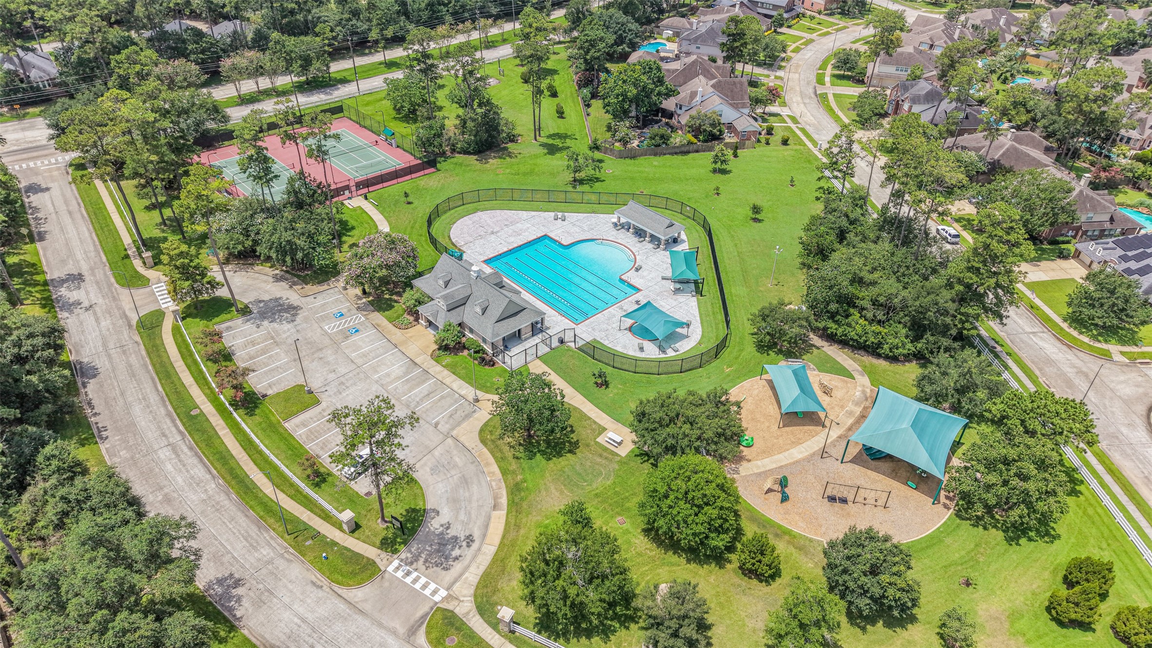 14919 Codys Run Cypress, TX 77429 - Photo 28 of 32 Enjoy the great amenities of Longwood Village including this amenity center (one of two in the neighborhood). Featuring a pool, park and tennis courts, the neighborhood provides lots of activities and community spirit.