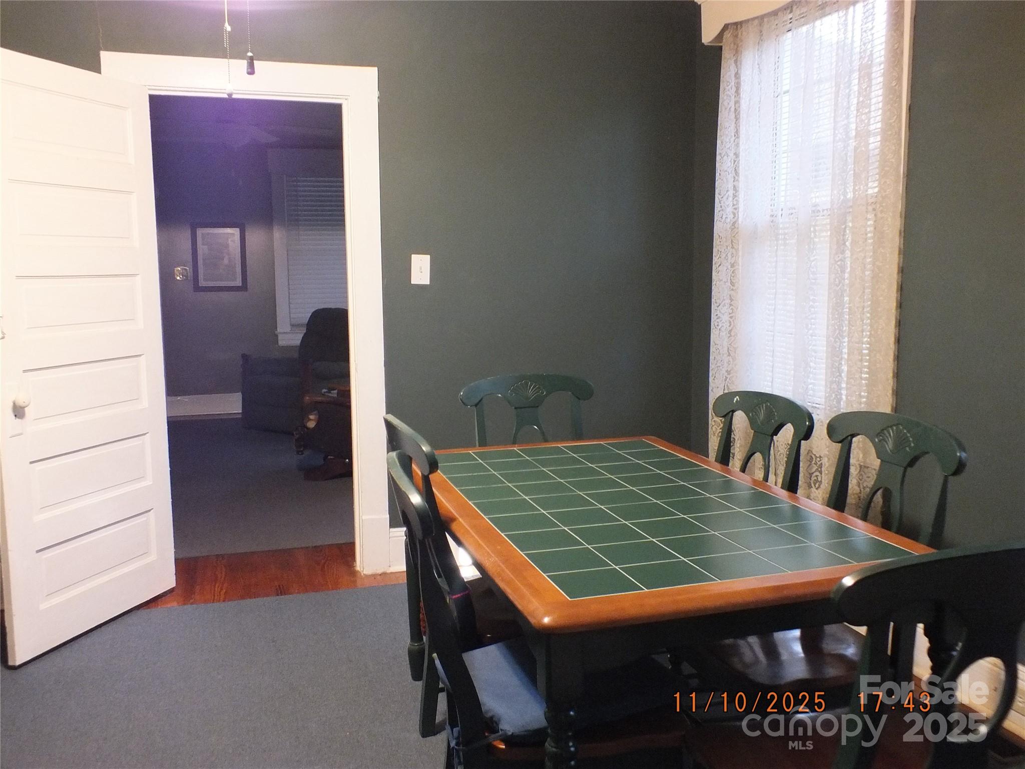 5034 State Rd S-29-20 Heath Springs, SC 29058 - Photo 11 of 43 a dining room with furniture and wooden floor