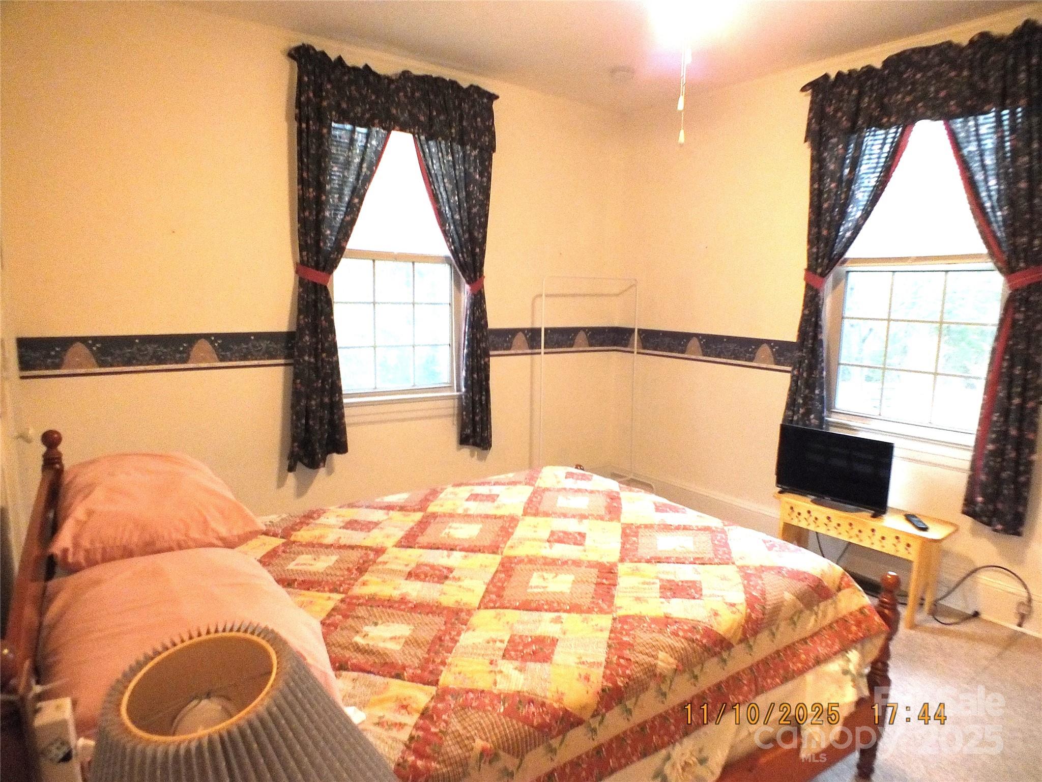 5034 State Rd S-29-20 Heath Springs, SC 29058 - Photo 19 of 43 a bedroom with a bed and a window