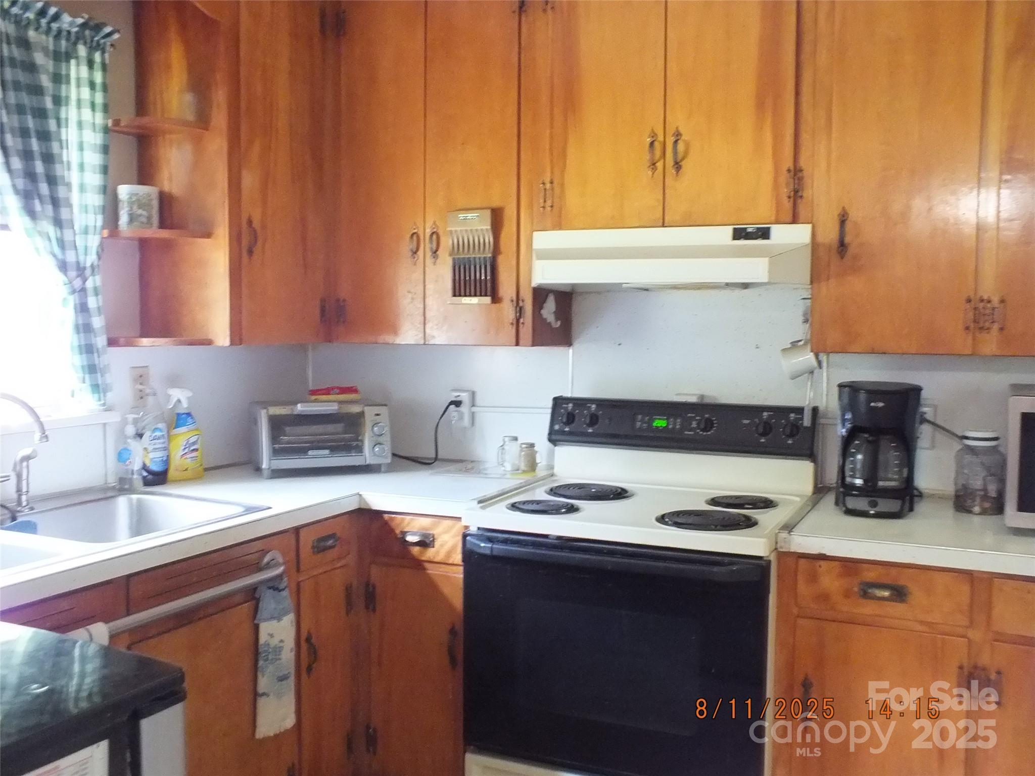 5034 State Rd S-29-20 Heath Springs, SC 29058 - Photo 8 of 43 a kitchen with a stove and a sink