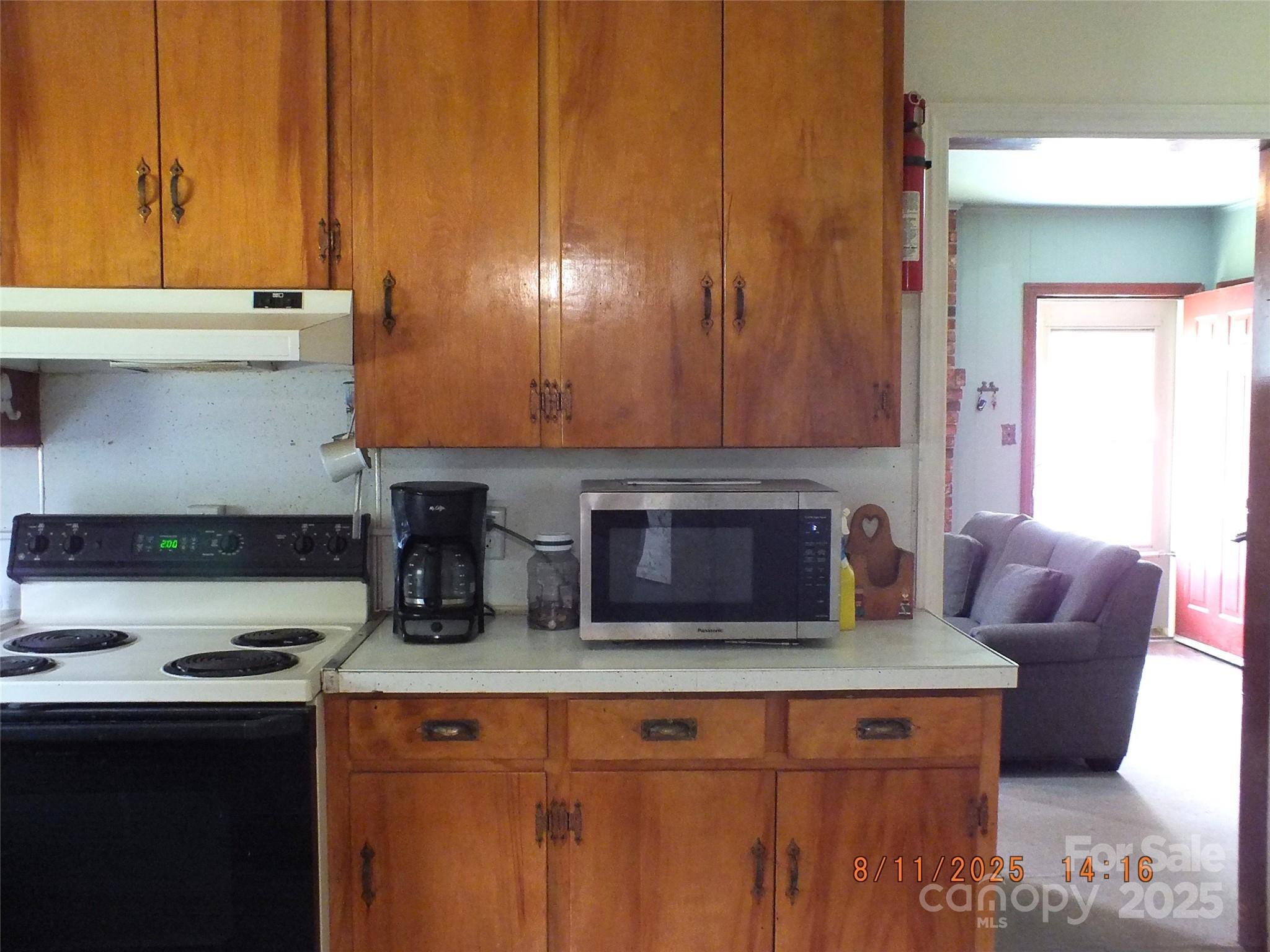 5034 State Rd S-29-20 Heath Springs, SC 29058 - Photo 9 of 43 a kitchen with a stove and a refrigerator