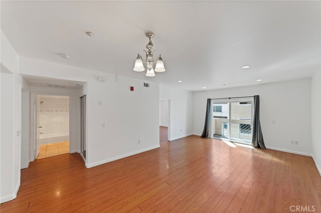 421 South Garfield Avenue, Unit 79 Monterey Park, CA 91754 - Photo 1 of 23 a view of livingroom with hardwood floor and kitchen view