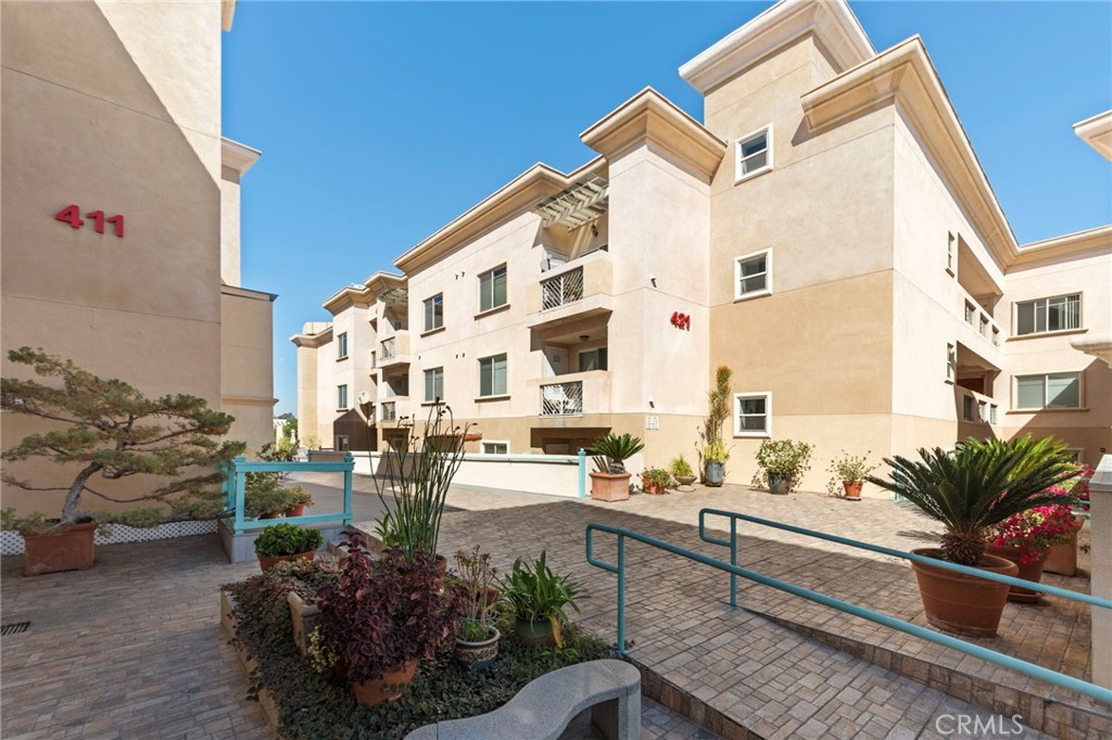 421 South Garfield Avenue, Unit 79 Monterey Park, CA 91754 - Photo 18 of 23 a view of balcony with outdoor seating and a potted plant