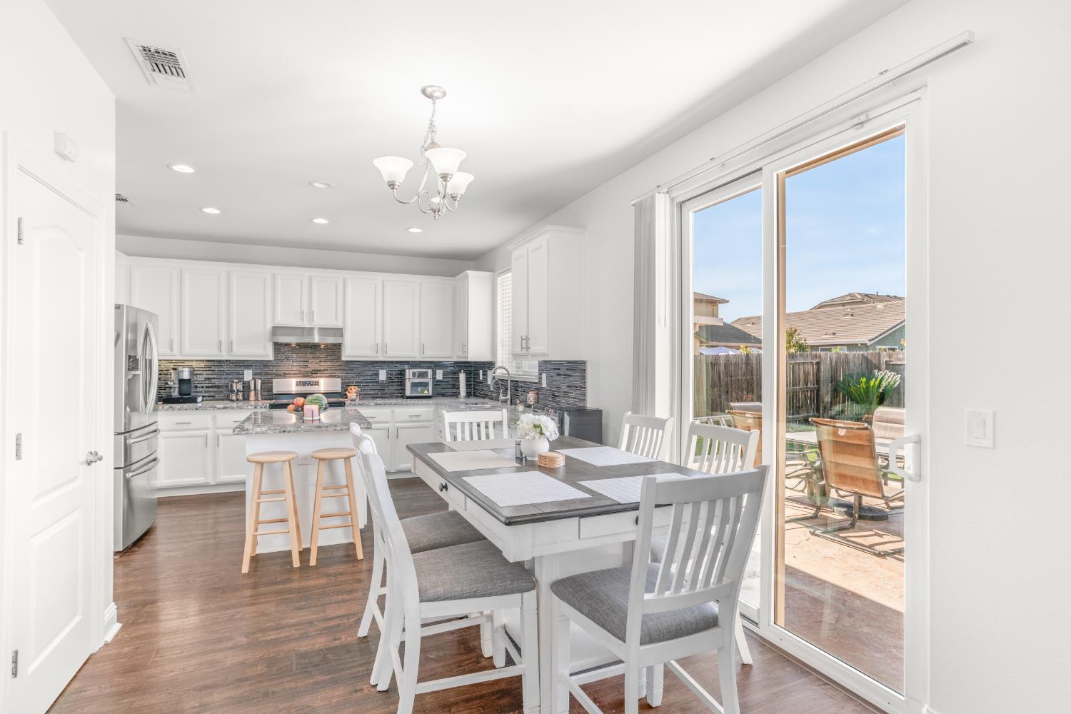 3815 Lee Brook Way Sacramento, CA 95838 - Photo 13 of 43 a view of a dining room with furniture window and wooden floor